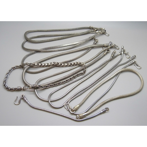 1128 - Nine metal necklaces and a bracelet