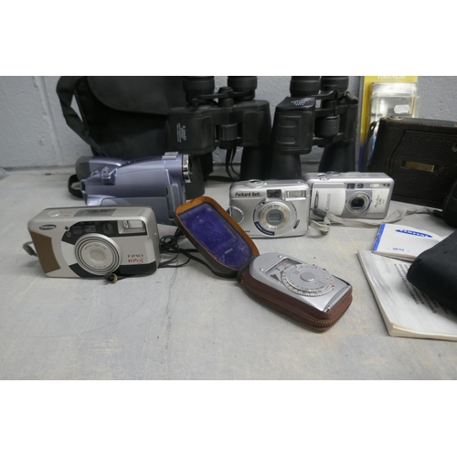 1156 - A Kodak folding camera, model H, other cameras including Canon, a light meter, a Canon camcorder and... 