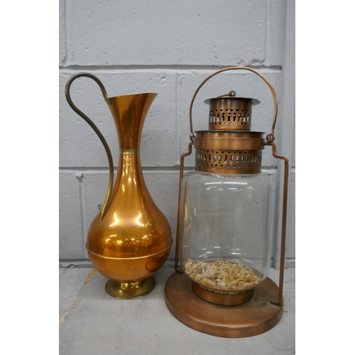 1161 - A metal lamp and a copper jug **PLEASE NOTE THIS LOT IS NOT ELIGIBLE FOR POSTING AND PACKING**