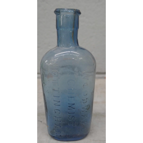 1163 - A collection of glassware, including blue glass chemist bottles, a 'banjo' shaped bottle, two glass ... 