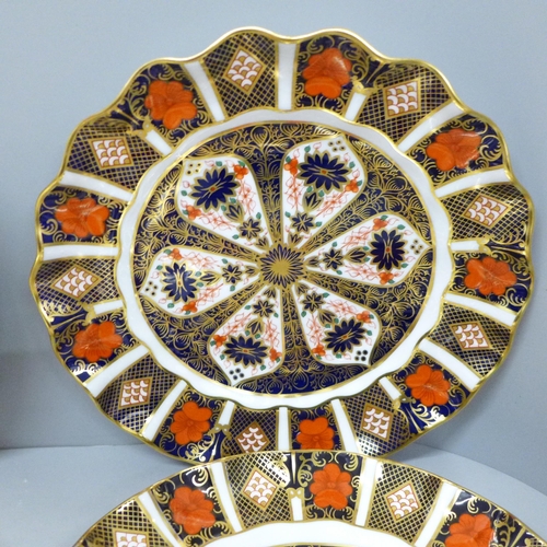 616 - Six Royal Crown Derby 1128 pattern plates; two octagonal, two circular and two wavy edge, one circul... 