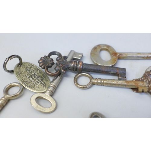 650 - Thirty keys, clock, cabinet, caddy and door keys, with a brass Will box key fob and Lincoln imp key ... 