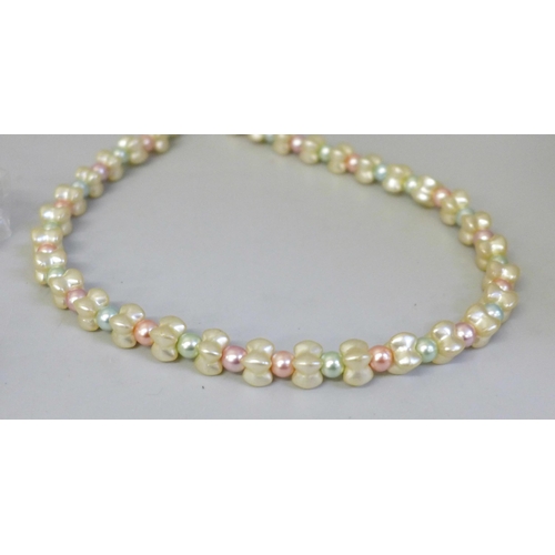 651 - A collection of faux pearl necklaces