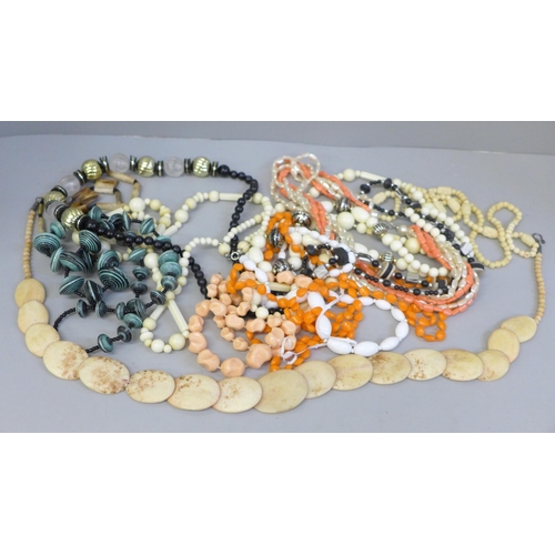 653 - Twelve costume necklaces