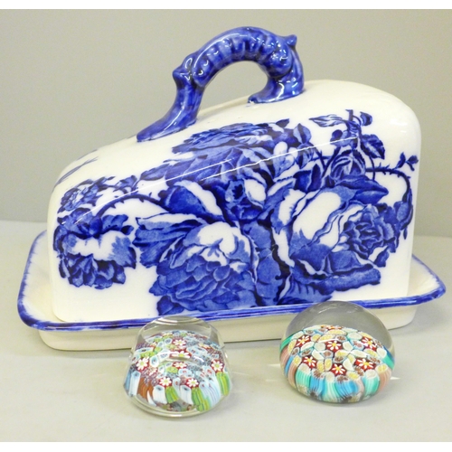 655 - A pair of millefiori glass paperweights and a blue and white cheese dish