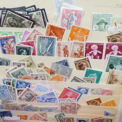 675 - Stamps; a box of stamp albums, covers, etc.