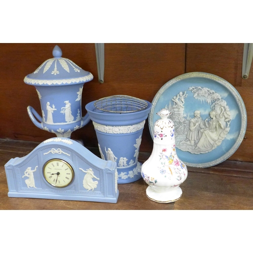 676 - A Wedgwood Jasperware urn, a flower frog and vase, a mantel clock, a similar style collector's plate... 