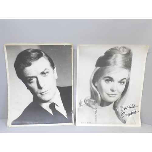 709 - A large publicity photograph of Shirley Eaton, signed and one other of Michael Caine