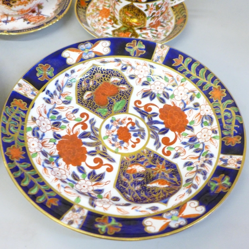 711 - Royal Crown Derby 198 pattern Imari china, four plates, slop bowl and two cups and saucers