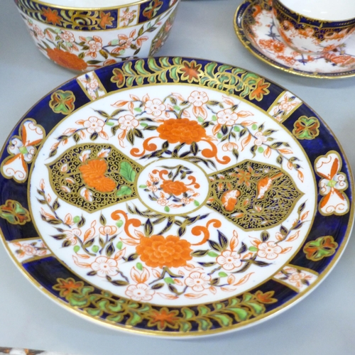 711 - Royal Crown Derby 198 pattern Imari china, four plates, slop bowl and two cups and saucers