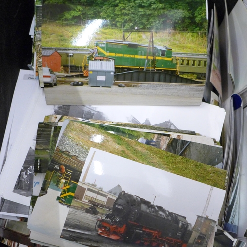 725 - A box of mixed postcards and locomotive photographs