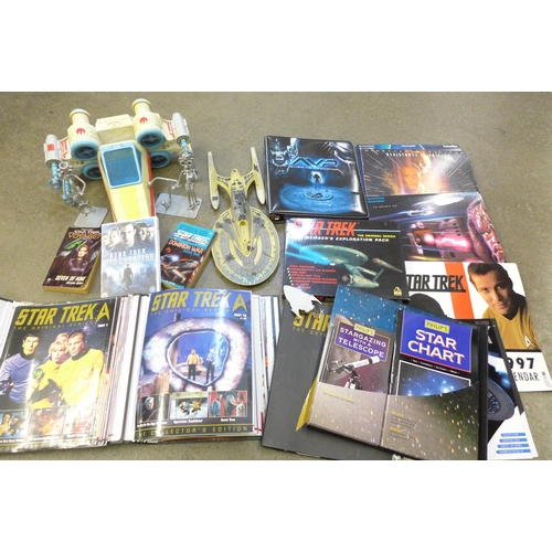 731 - A collection of Star Trek models, an exploration pack, three laser discs, etc.