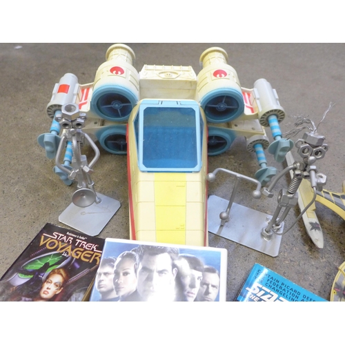 731 - A collection of Star Trek models, an exploration pack, three laser discs, etc.