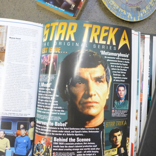 731 - A collection of Star Trek models, an exploration pack, three laser discs, etc.