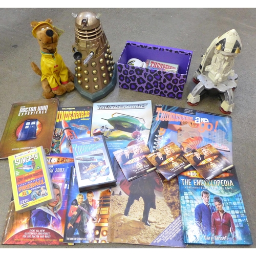 735 - A collection of Dr. Who and Thunderbirds items including books, a model Dalek and a Scooby Doo soft ... 