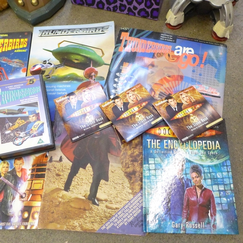 735 - A collection of Dr. Who and Thunderbirds items including books, a model Dalek and a Scooby Doo soft ... 