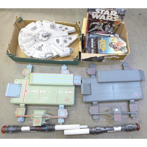 743 - A Star Wars Millennium Falcon model, two light sabers, two landing ports and a collection of Star Wa... 