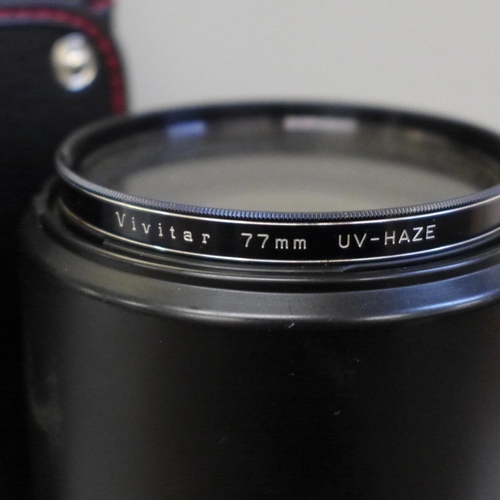 754 - A Sigma 135-400mm lens, cased