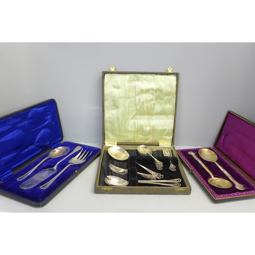 785 - A cased pair of large engraved plated spoons and two other cased silver plated flatware sets