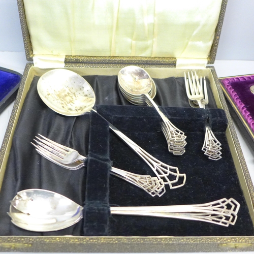 785 - A cased pair of large engraved plated spoons and two other cased silver plated flatware sets