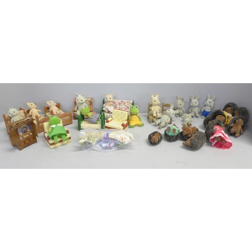 790 - A box of Sylvanian Families and furniture