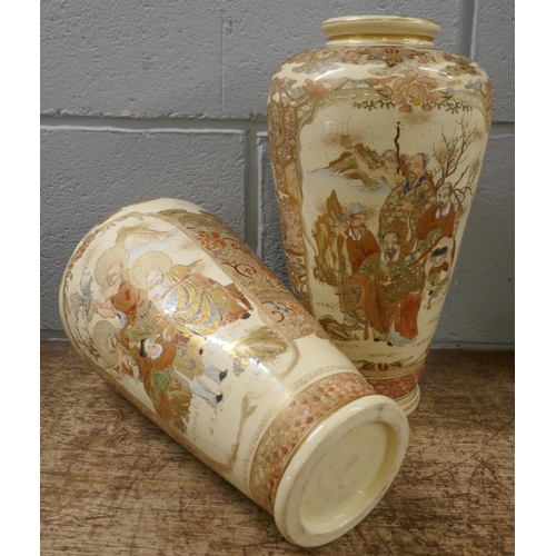 806 - A pair of Japanese Meiji period Satsuma vases decorated in enamels and gilt, painted all over with s... 