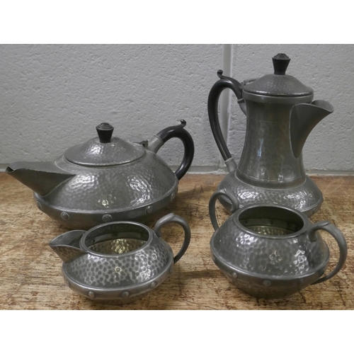 810 - A Craftsman Arts and Crafts four piece hammered pewter tea service