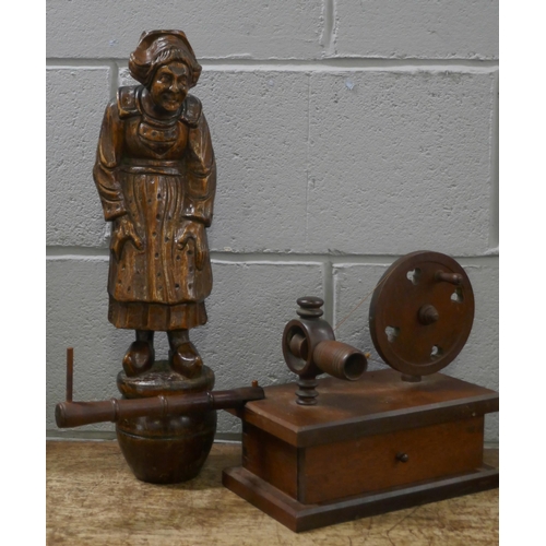 812 - A carved wooden figure of a Dutch lady and a wooden lace bobbin winder