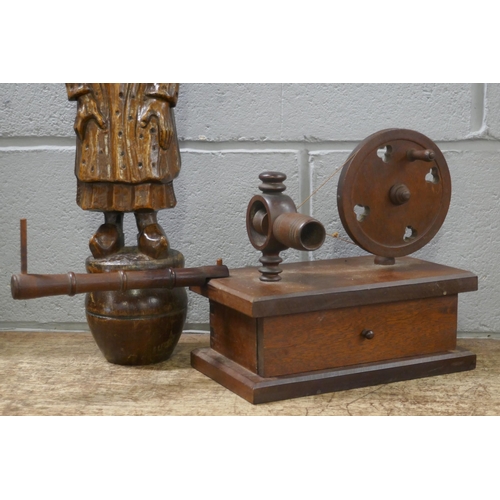 812 - A carved wooden figure of a Dutch lady and a wooden lace bobbin winder