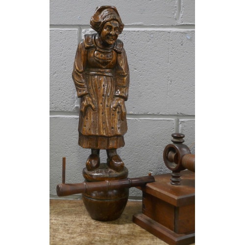 812 - A carved wooden figure of a Dutch lady and a wooden lace bobbin winder