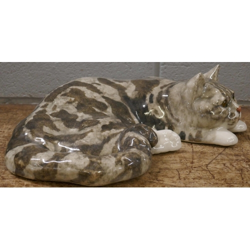 814 - A large Winstanley cat, laying, 36cm