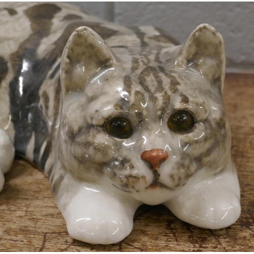 814 - A large Winstanley cat, laying, 36cm