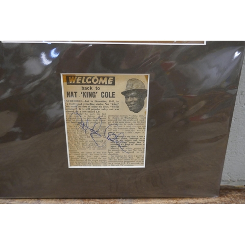 820 - A Nat King Cole autographed display