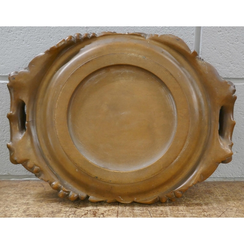 828 - A carved walnut religious collection tray, 'Give Us This Day Our Daily Bread', 43cm