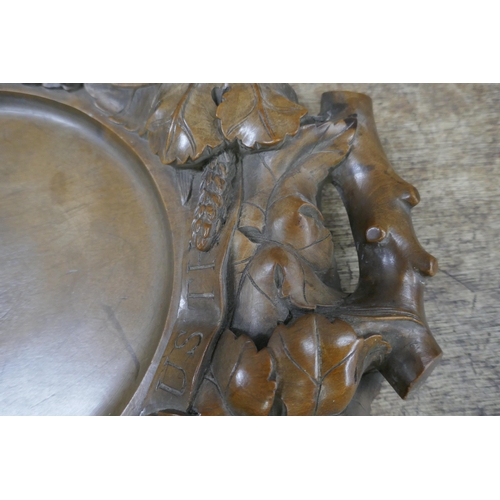 828 - A carved walnut religious collection tray, 'Give Us This Day Our Daily Bread', 43cm