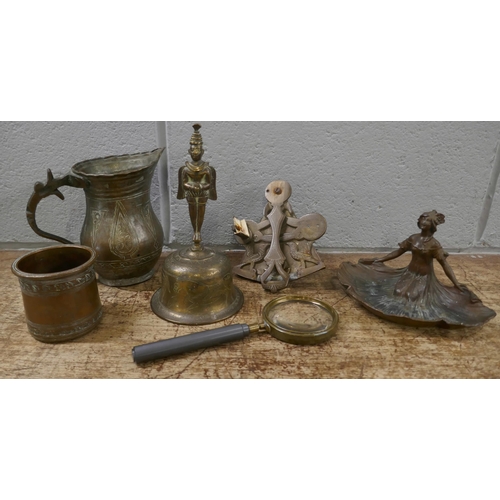 829 - A collection of metal items including an Art Nouveau style figural dish, a bell, jug, etc.