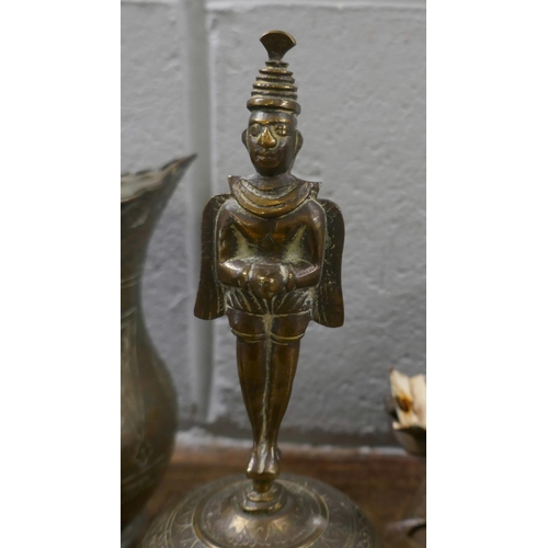 829 - A collection of metal items including an Art Nouveau style figural dish, a bell, jug, etc.