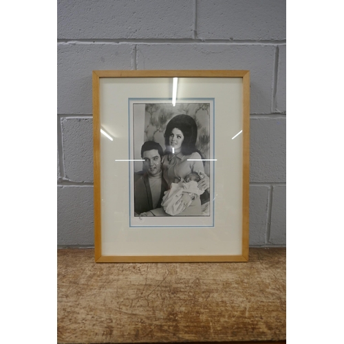 830 - Elvis and Priscilla Presley, 25cm x 40cm, photograph holding baby Lisa Marie, limited edition 19/21 ... 