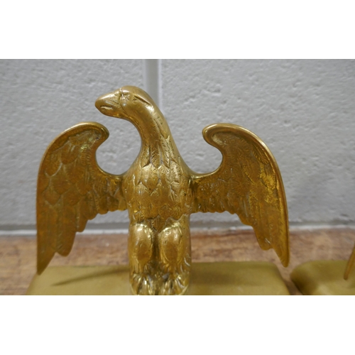 831 - A pair of brass eagle figures, 16cm, and a bronze paperweight