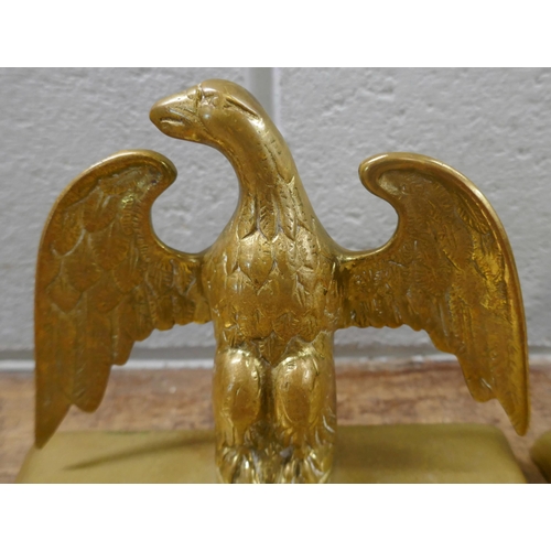 831 - A pair of brass eagle figures, 16cm, and a bronze paperweight