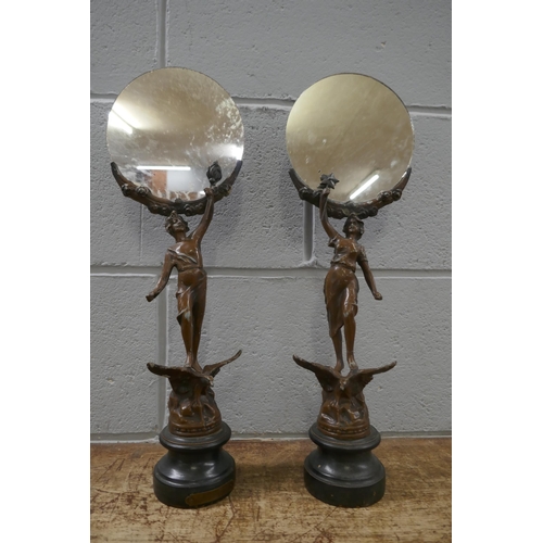 833 - A pair of French painted spelter figural mirrors, 46cm