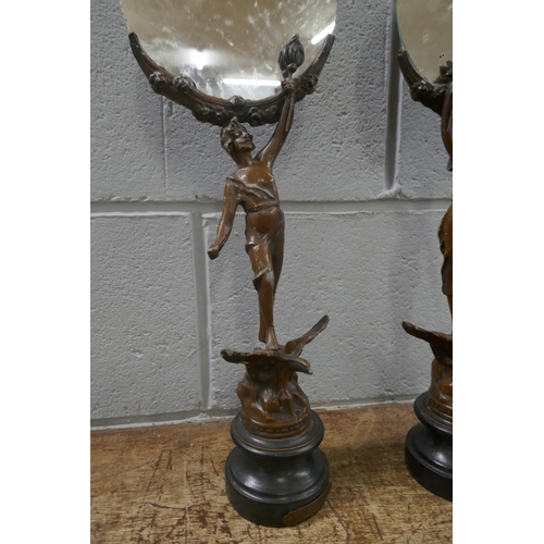 833 - A pair of French painted spelter figural mirrors, 46cm