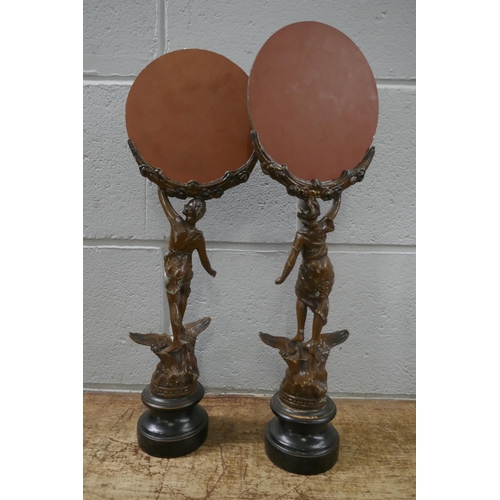 833 - A pair of French painted spelter figural mirrors, 46cm