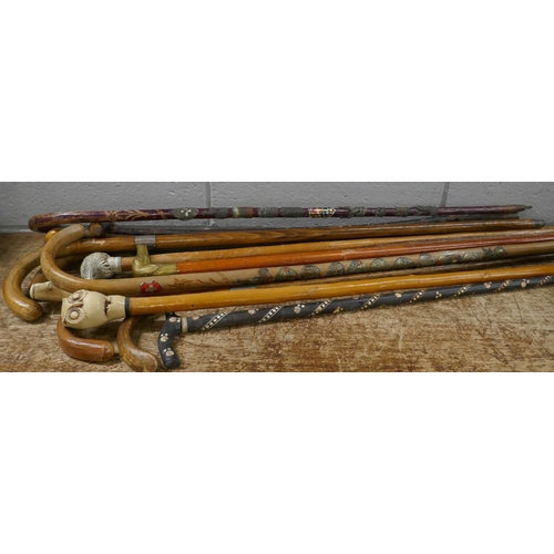 841 - A collection of walking sticks