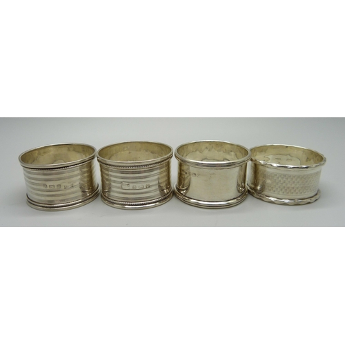 870 - A pair and two single silver napkin rings, 54g