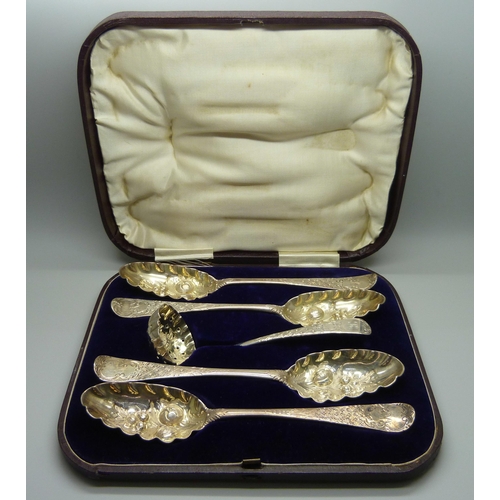 879 - Four George II silver berry spoons and a later silver sugar sprinkler, London 1742-1743, 255g