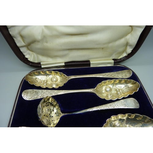 879 - Four George II silver berry spoons and a later silver sugar sprinkler, London 1742-1743, 255g