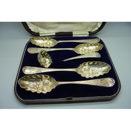 879 - Four George II silver berry spoons and a later silver sugar sprinkler, London 1742-1743, 255g