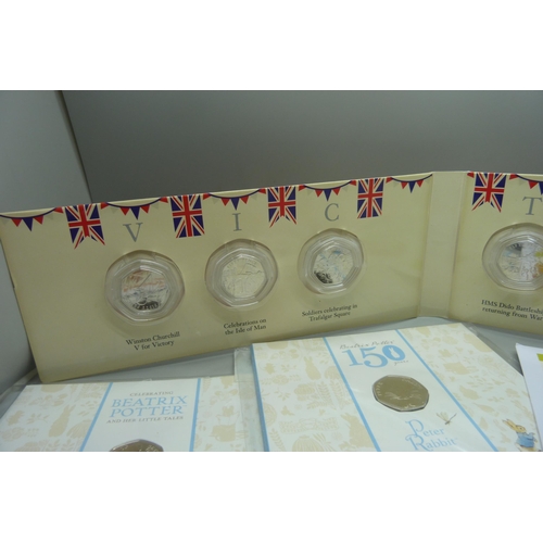 884 - A collection of 50p coins, VE Day, Beatrix Potter including four coin covers and three Royal Mint, e... 