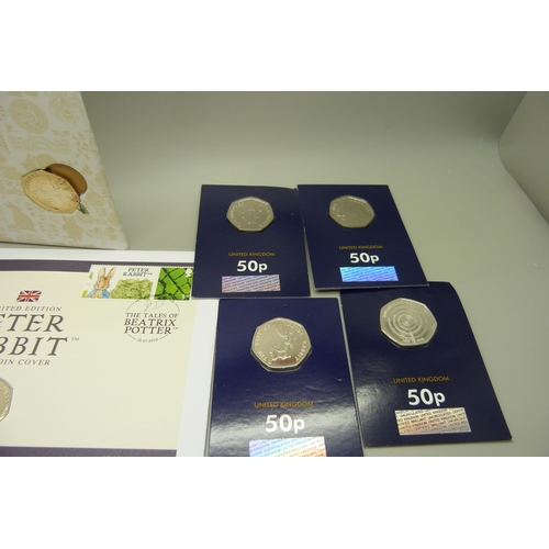 884 - A collection of 50p coins, VE Day, Beatrix Potter including four coin covers and three Royal Mint, e... 